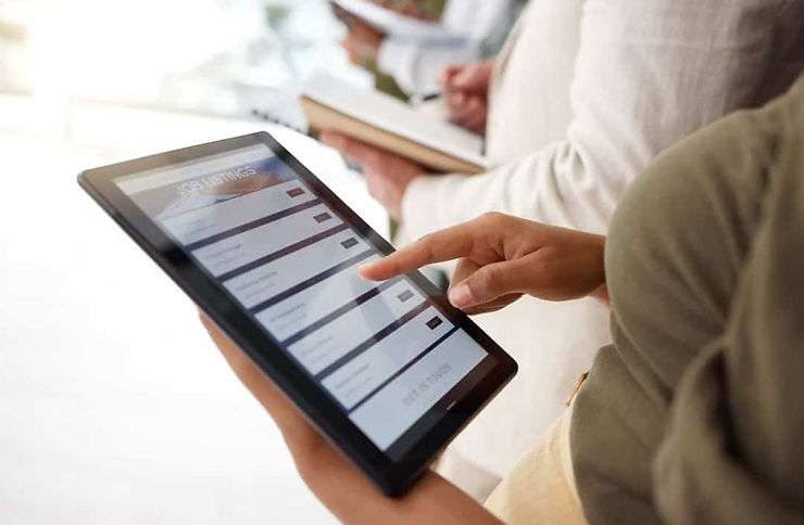 Person working on tablet.