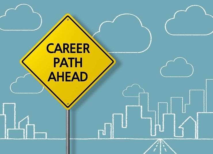"Career path ahead" written on yellow sign.