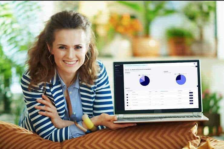 Woman holding laptop. 