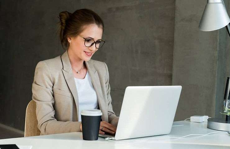 Woman working on laptop. 