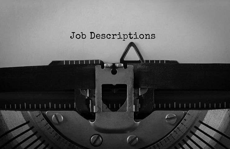 Typewriter with typed "job descriptions".
