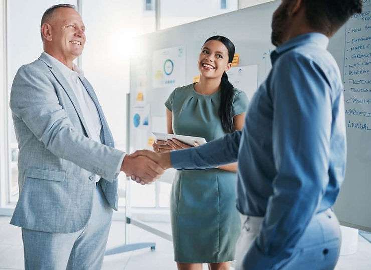 Three coworkers talking.